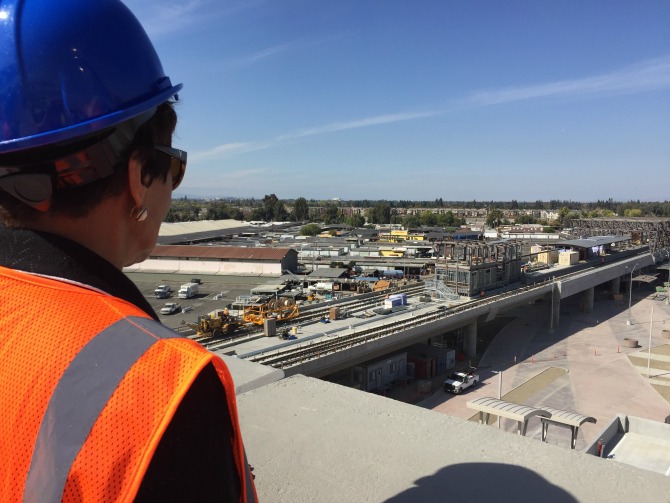 Carolyn Flowers perched atop of Berryessa BART Station garage